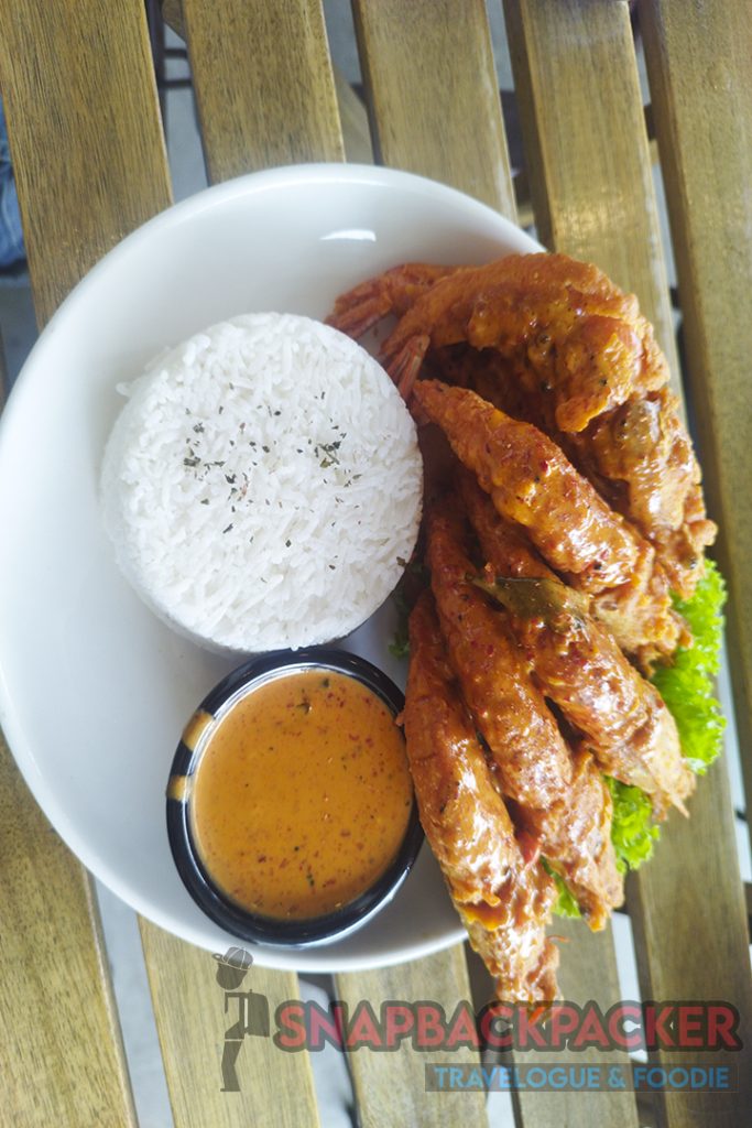 a plate of food on a wood table